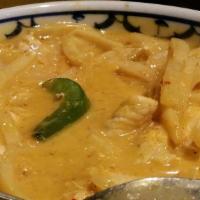 Red Curry · Your choice of pork, beef, chicken, squid, shrimp, or scallops cooked in red curry with coco...