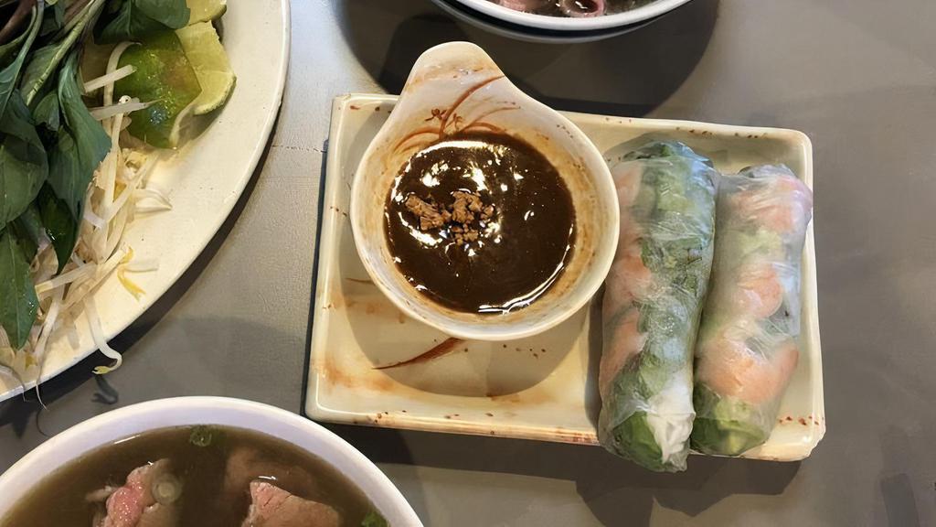 Vegetarian Summer Rolls-Goi Cuon Chay · Delicate rice paper rolled around strips of fried tofu, lettuce, and rice vermicelli. Served chilled with a peanut dipping sauce topped with crushed peanuts.
