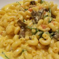 Mac & Cheese · Cavatappi pasta, swiss and cheddar sauce sauteed mushrooms, arugula, and tomatoes.