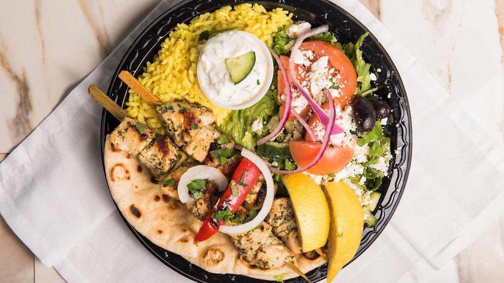 Chicken Souvlaki · Two skewers of chicken marinated in our special lemon herbs and spices.