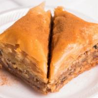 Baklava · Cinnamon and crushed walnuts in fine fillo pastry layers topped with honey.