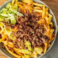 Solár Loaded Fries · Large plate of fries topped with Impossible Meat, house specialty coleslaw, guacamole aioli,...