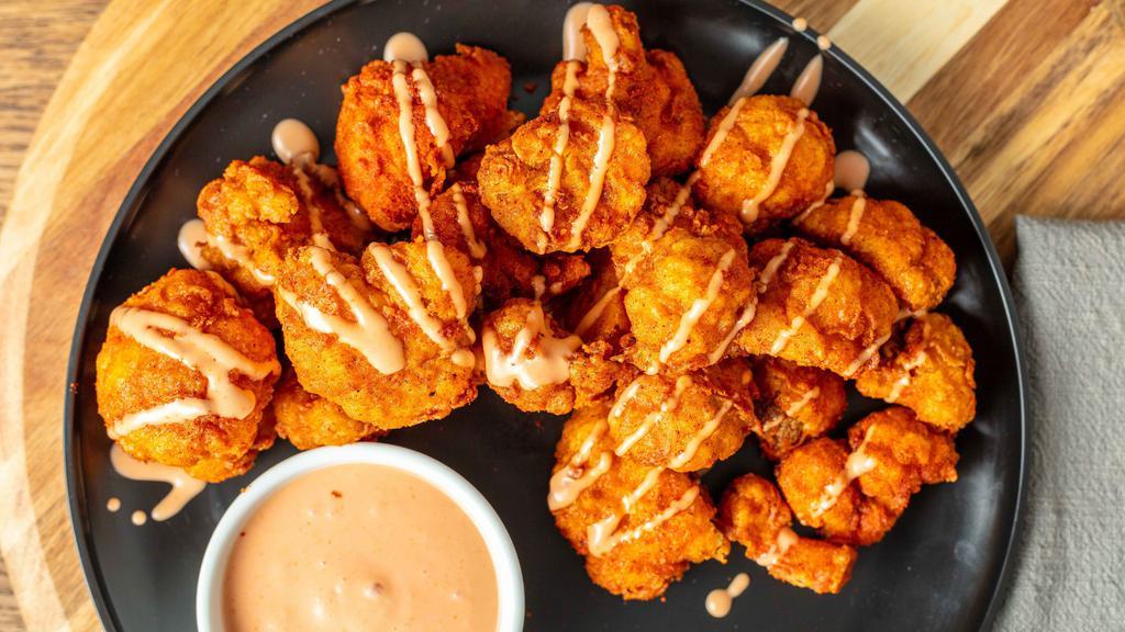 Fried Cauliflower Wings · One plate of individually breaded and fried cauliflower wings tossed with our house seasoning, served with a side of buffalo sauce and Solár Sauce.
100% Plant-Based Vegan.