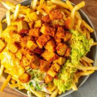 Solár Loaded Chicken Fries · Vegan Nashville Hot Chicken tenders shredded and seasoned on a large plate of fries. Comes w...