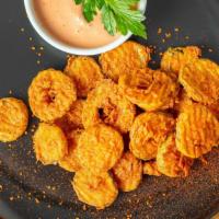 Spicy Fried Pickles · 12 oz serving of perfectly hand battered and fried pickles topped and seasoned with our spec...