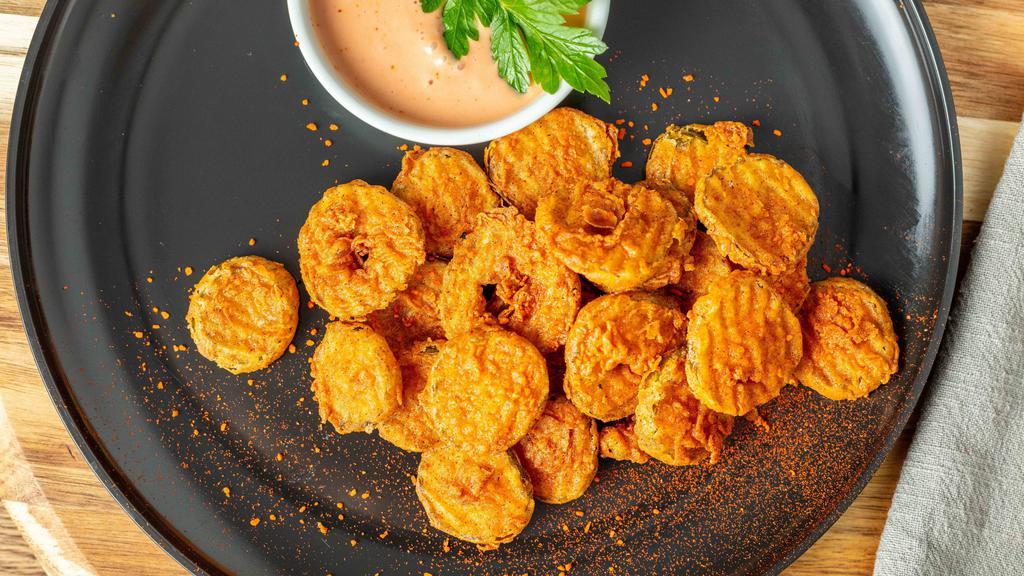 Spicy Fried Pickles · 12 oz serving of perfectly hand battered and fried pickles topped and seasoned with our special house spice. Served with a side of our Solár Sauce.
100% Plant-Based Vegan.