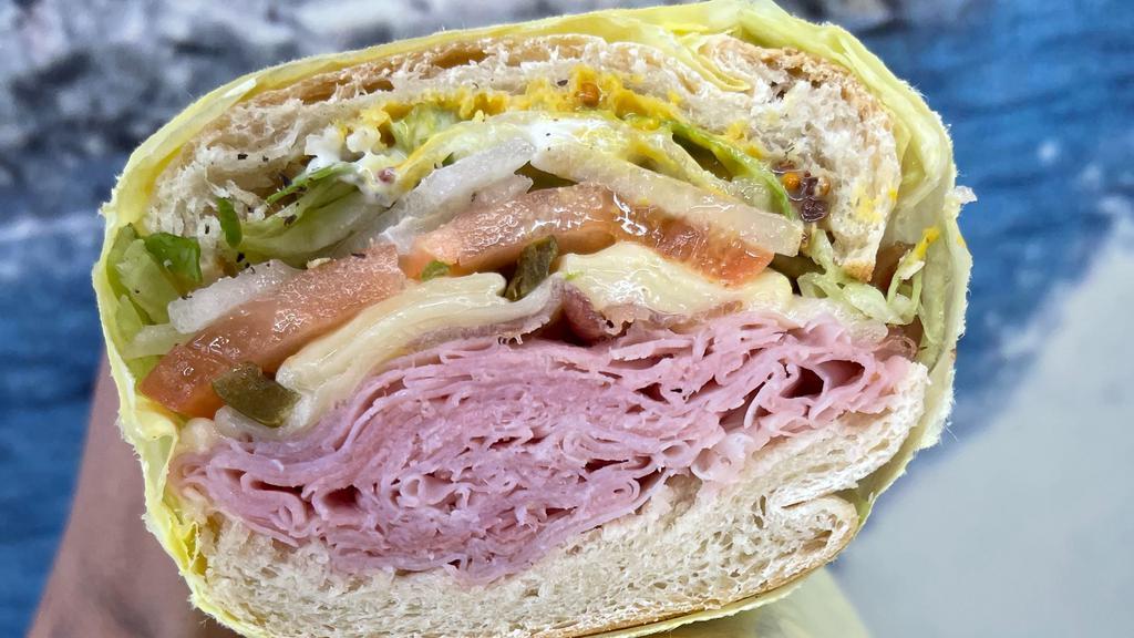 Ham & Swiss · Slow cured ham and swiss cheese made the Brooklyn Style with tomatoes, lettuce, onion, mixed spices,vinegar, oil and mayo.