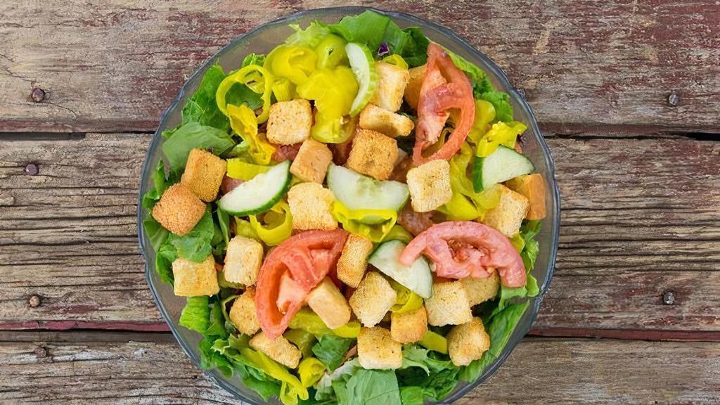 Garden Salad · Mixed greens, cabbage and carrots, tomatoes, cucumber, pepperoncinis, croutons and your choice of dressing.