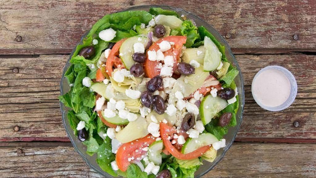 Greek Salad · Mixed greens, cabbage and carrot mix, tomatoes, cucumbers, feta cheese, artichoke hearts, kalamata olives, bell peppers, red onions, and Greek dressing.