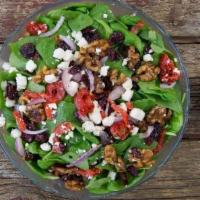 Spinach Salad · Fresh baby spinach, roasted red peppers, candied walnuts, choice of bleu cheese crumbles or ...
