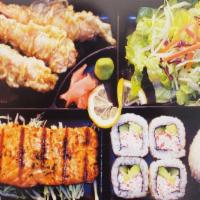 Salmon Bento · Salmon, shrimp tempura (3 pieces), california rolls (4 pieces), rice and salad.