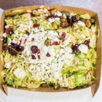 Shaved Brussels & Farrow Salad · Vegetarian. Dried cranberries, Goat cheese, pistachios, parsley, and mustard vinaigrette. Ve...