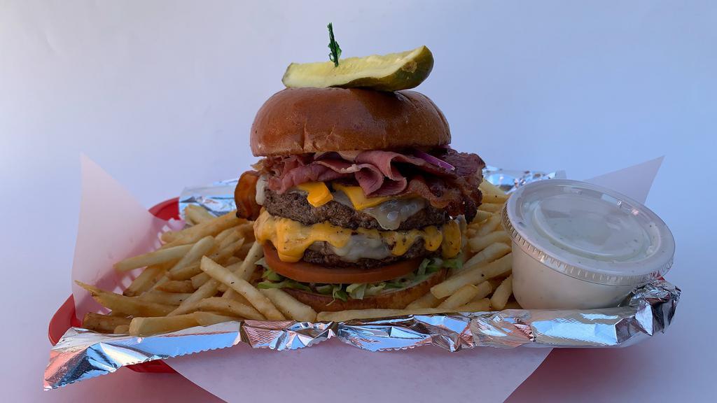 The Beast Burger · (2)  1/2  Lb. Burger patties, Pastrami, Bacon, Swiss and American Cheese