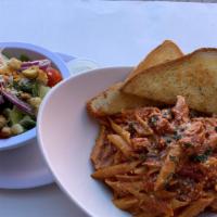 Chicken And Penne Pasta A La Vodka · Grilled chicken breast with penne pasta and delicious creamy vodka sauce.