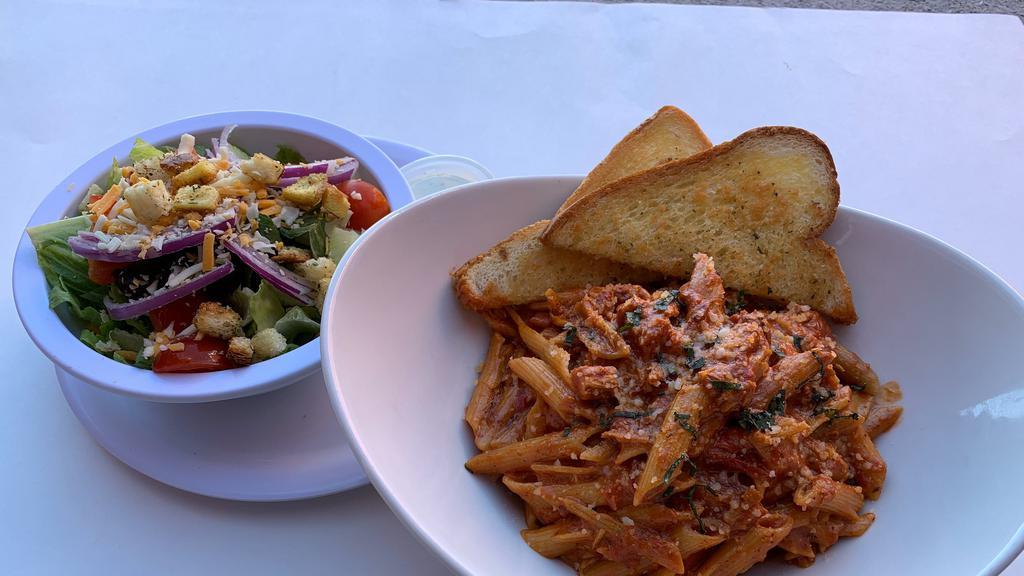 Chicken And Penne Pasta A La Vodka · Grilled chicken breast with penne pasta and delicious creamy vodka sauce.
