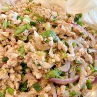 Larb Chicken, Pork, Or Beef Salad · Ground chicken, pork, or beef salad in a spicy lime dressing with shallots and mint leaves.