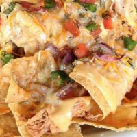 Nachos · Refried beans, shredded cheese, green chili, queso, & pico de gallo. Served with salsa. Choo...