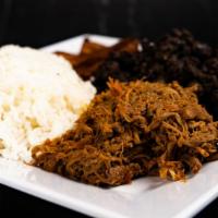 Pabellon · White Rice, Black beans, shered Beef, fry plantain and chees