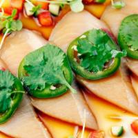 Jalapeno Sashimi · Yellowtail with yuzu soy, olive oil, ginger, cilantro, and topped with parapara.