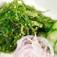 Seaweed Salad · Marinated seaweed with cucumber slices.