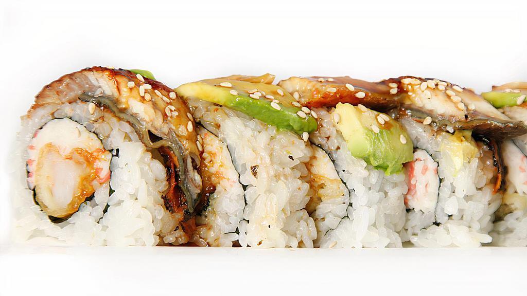 Dragon Roll · Shrimp tempura, crab & cucumber topped with smoked eel & avocado.