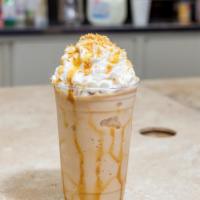 Caramel Caribou Frappe · The perfect blend of white chocolate, caramel, and coconut topped with toasted coconut.