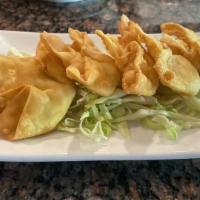 Crab Puffs · Cream cheese and crab meat deep fried in wonton skin.