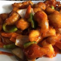 Sweet & Sour Chicken · Deep fried white chicken strips, topped with bell peppers, onions, carrots, pineapple with d...