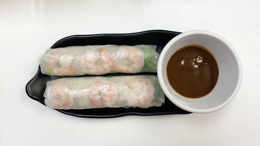 Spring Rolls (2) · Rice paper wrapped with shrimp, pork, vermicelli noodles, lettuce. Served with peanut dipping sauce.