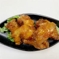 Hot & Spicy Chicken Wings · Spicy. Fried chicken wings tossed in sweet & spicy sauce with a choice of fish sauce or swee...