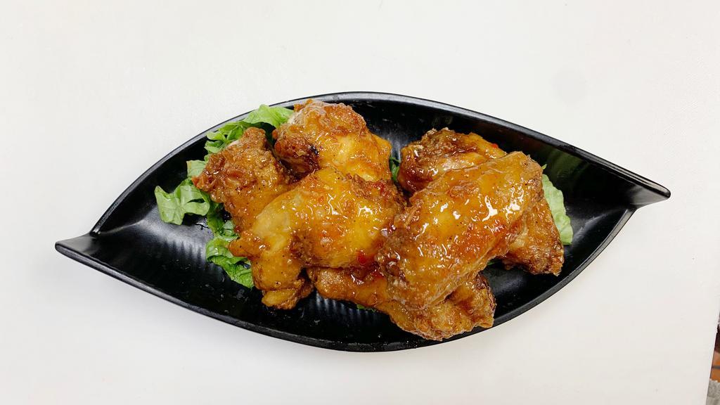Hot & Spicy Chicken Wings · Spicy. Fried chicken wings tossed in sweet & spicy sauce with a choice of fish sauce or sweet chili.