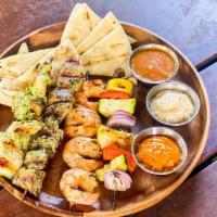 Picnic Kebobs · Chargrilled chicken, pork, shrimp & farm vegetables with Harissa aioli, gold sauce, hummus &...
