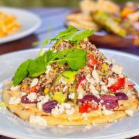 Veggie Stack · Grilled pita, hummus, black quinoa, tomato, cucumber, avocado, radish, kalamata olives, feta...