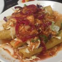 Tacos Dorados · Cabbage or lettuce, cheese and salsa.