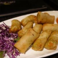 Spring Roll · Sautéed assorted veggies with clear noodle, crispy fried in a pastry roll, served with a plu...