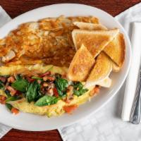 Veggie Omelette · Our veggie omelet freshly made with spinach, mushrooms, onions, peppers, tomatoes and Swiss ...