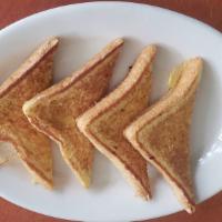 French Toast (1 Slice) · Served with butter and syrup.