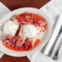 Strawberry And Sweet Cream Crepes · Three delicate crepes rolled with sweet cream cheese filling, topped with glazed strawberrie...