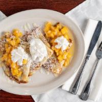 Peach Crepes · Three delicate crepes topped with glazed peaches and whipped cream.