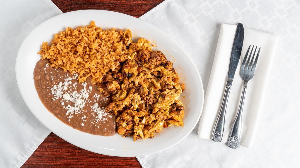 Huevos Con Chorizo · Spicy Mexican sausage fried with onions and tomatoes in scrambled eggs served with rice and beans and choice of tortilla.

Consuming raw or undercooked meets, poultry, seafood, shellfish, or eggs may increase your risk of food born illnesses.