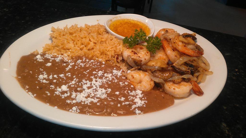 Camarones Al Mojo De Ajo · Sautéed prawns, freshly chopped garlic, mushrooms, onions and butter. Served with rice and beans and choice of tortilla.

Consuming raw or undercooked meets, poultry, seafood, shellfish, or eggs may increase your risk of food born illnesses.