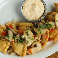 Pork Pierogies · Boiled or fried, garnished with mushrooms, onions, garlic, and red pepper flake. Served with...