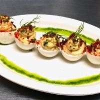 Deviled Eggs · Red onion, dill pickle, chive oil.