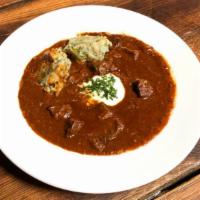 Bohemian Beef Goulash · Made with finely cut pieces of beef and paprika and onion sauce. Served with classic Czech b...