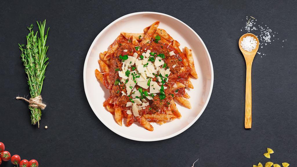 Bolognese Pasta · Fresh Cavatappi pasta cooked in a meaty red sauce and topped with black pepper, parsley, and parmesan.