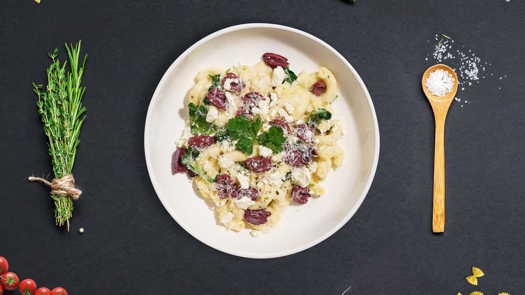 Greek Mac · Fresh spinach, feta, and greek olives cooked in a blend of creamy cheese and topped with parmesan. Cavatappi pasta.