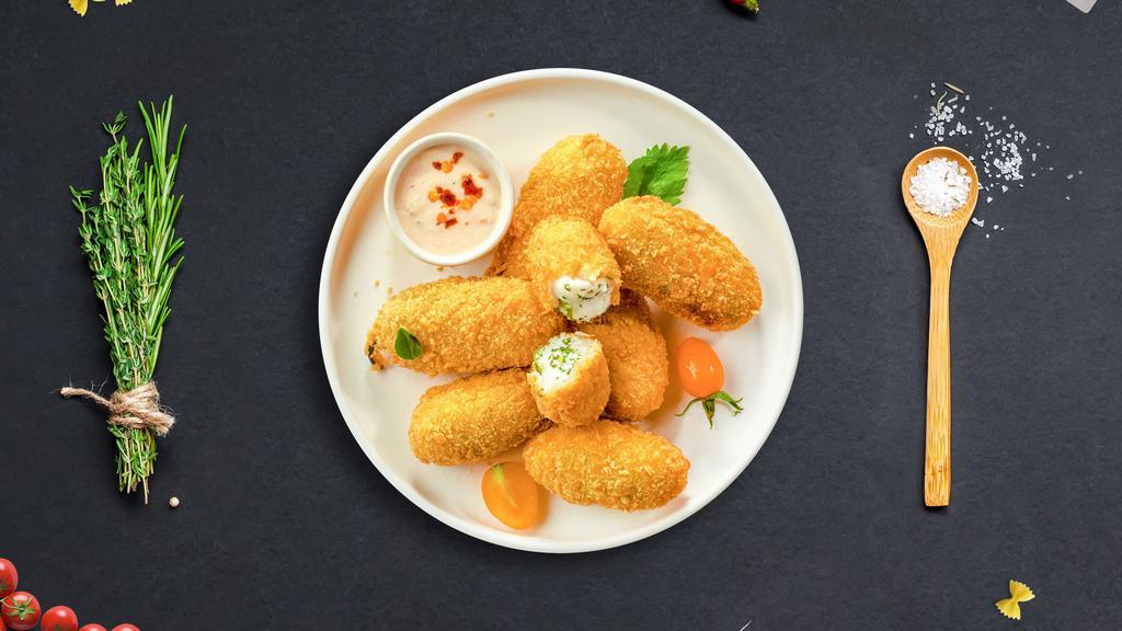 Jalapeno Poppers · Fresh jalapenos coated in cream cheese and fried until golden brown