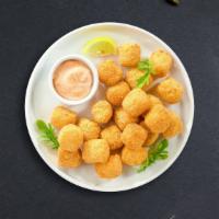 Tater Tots  · (Vegetarian) Shredded Idaho potatoes formed into tots, battered, and fried until golden brow...