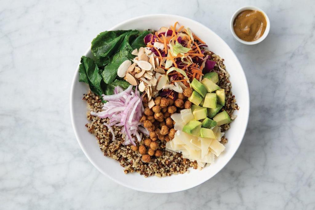 Balsamic Quinoa Kale Bowl · Avocado, cabbage blend, red onions, toasted chickpeas, toasted almonds, shaved parmesan, sauteéd organic baby kale, and balsamic vinaigrette on a bed of quinoa.