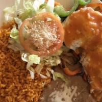 Huevos Rancheros · Served with Rice, Beans, Cheese, Lettuce and Tomatoes.